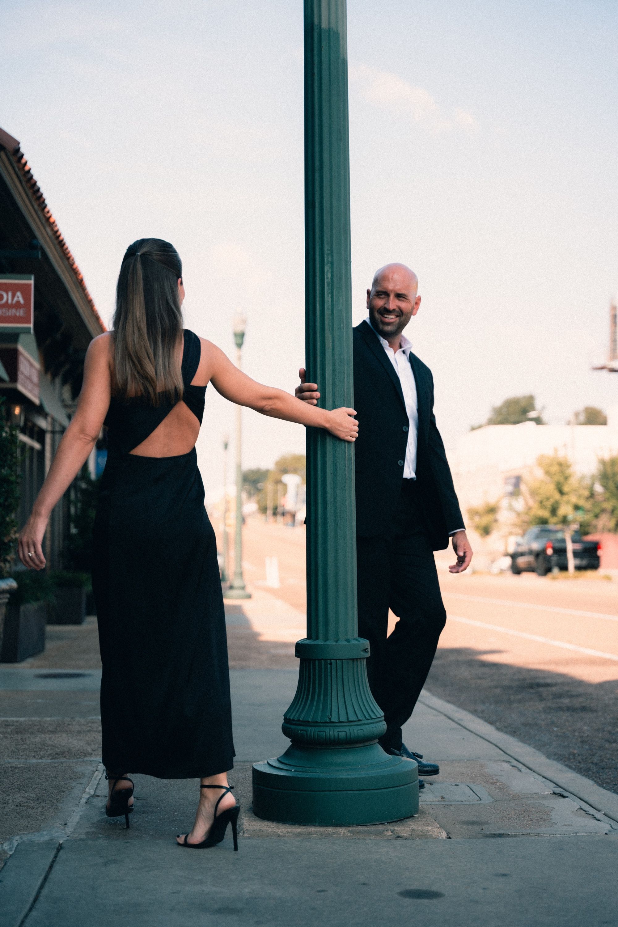 Couple beneath a lamppost, Memphis engagement photography by Atkinson Studio