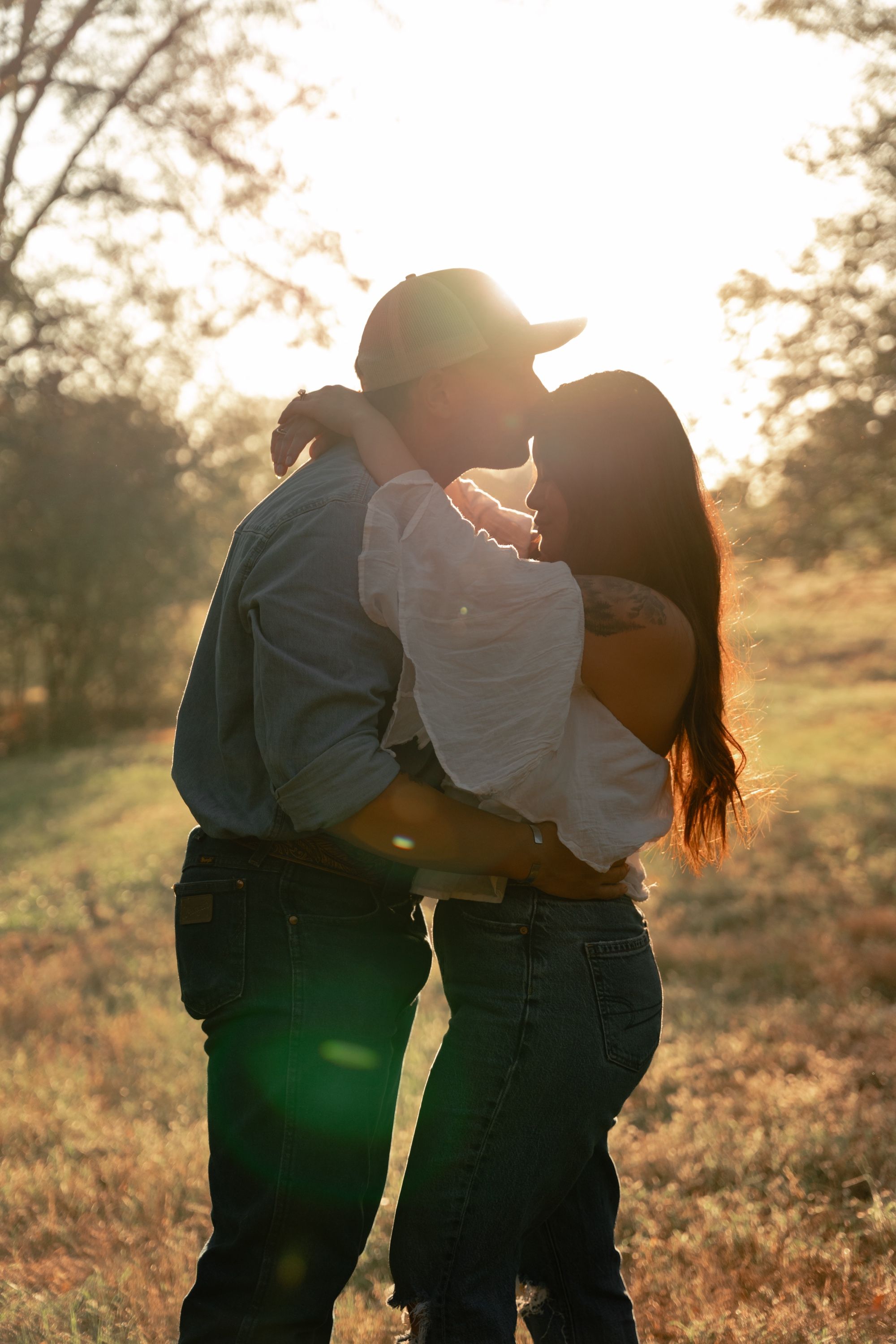 Golden hour engagement kiss, Memphis engagement photography by Atkinson Studio