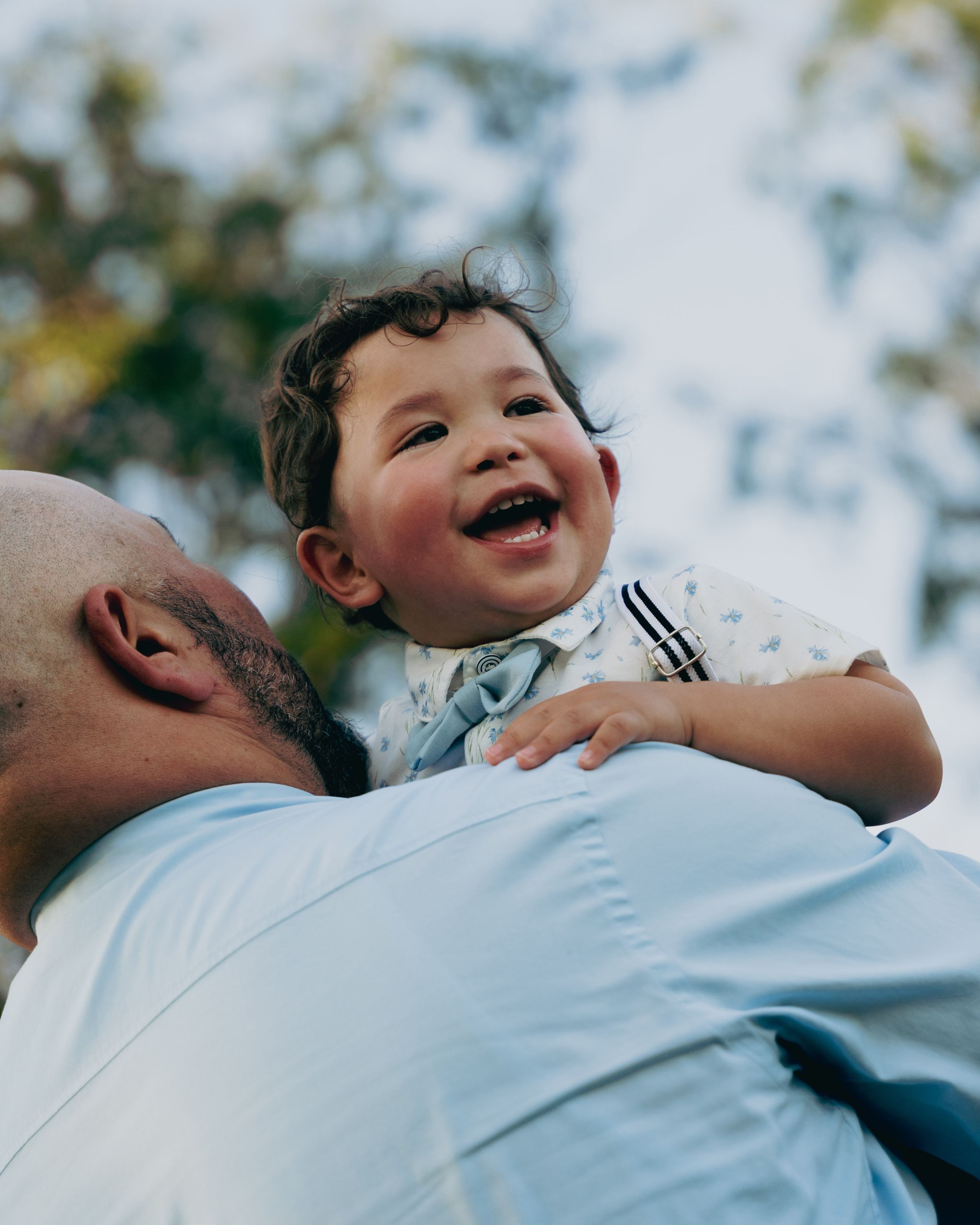 Family portrait, laughing over a shoulder, Memphis family photography by Atkinson Studio