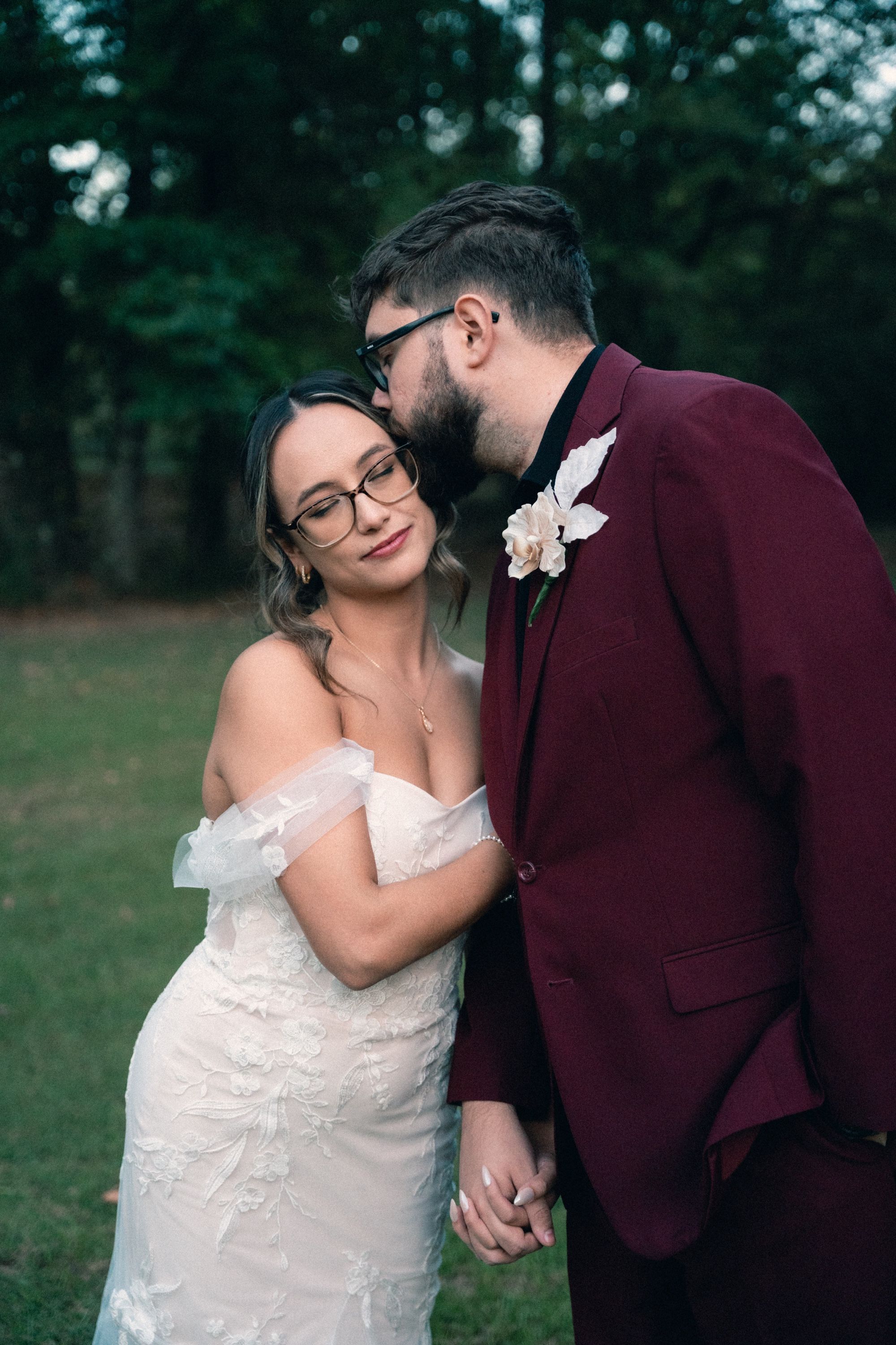 Bride and groom kissing at dusk, Memphis wedding photography by Atkinson Studio