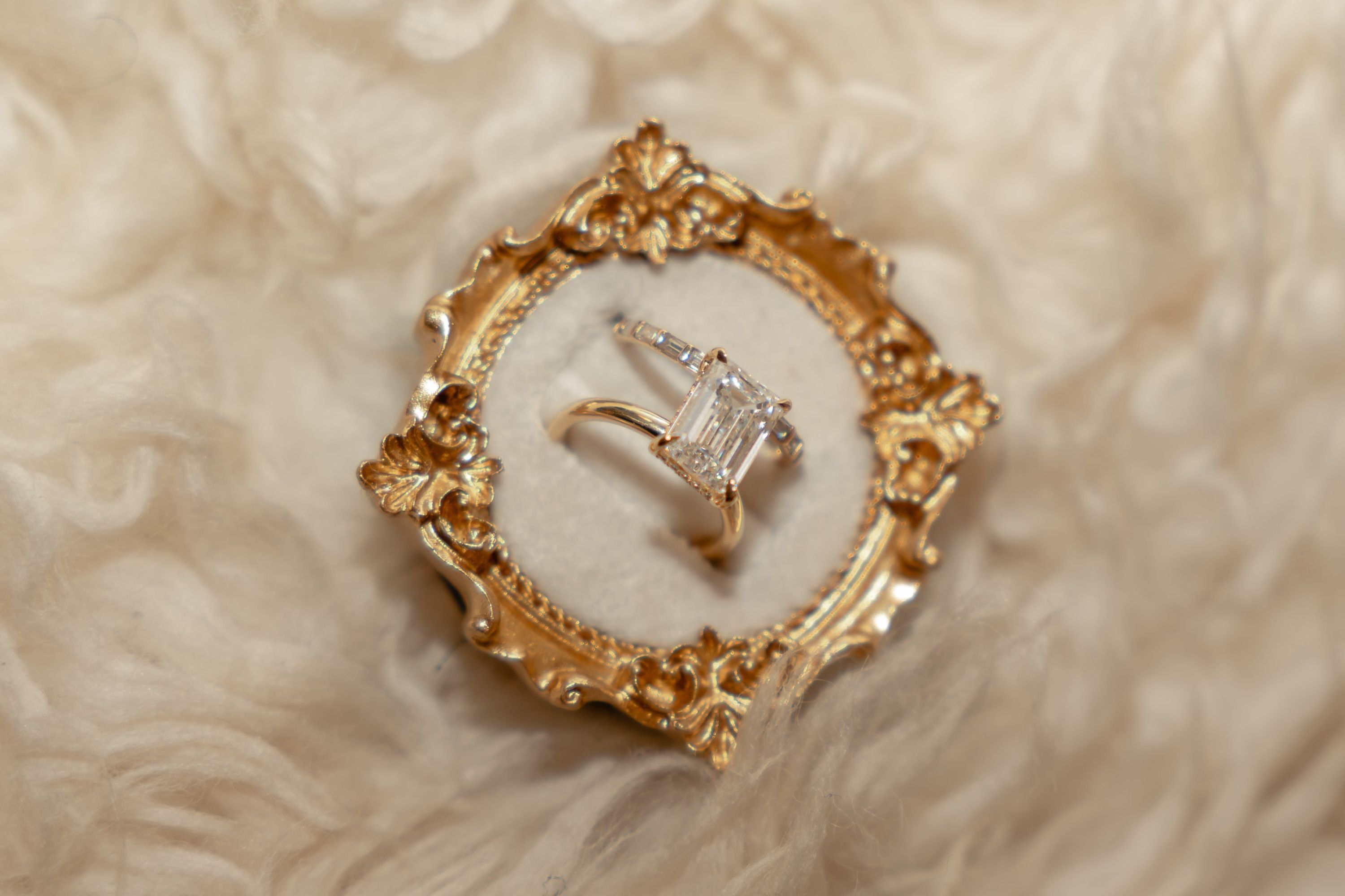 Wedding rings in a gold frame at a nikah, Memphis wedding photography by Atkinson Studio