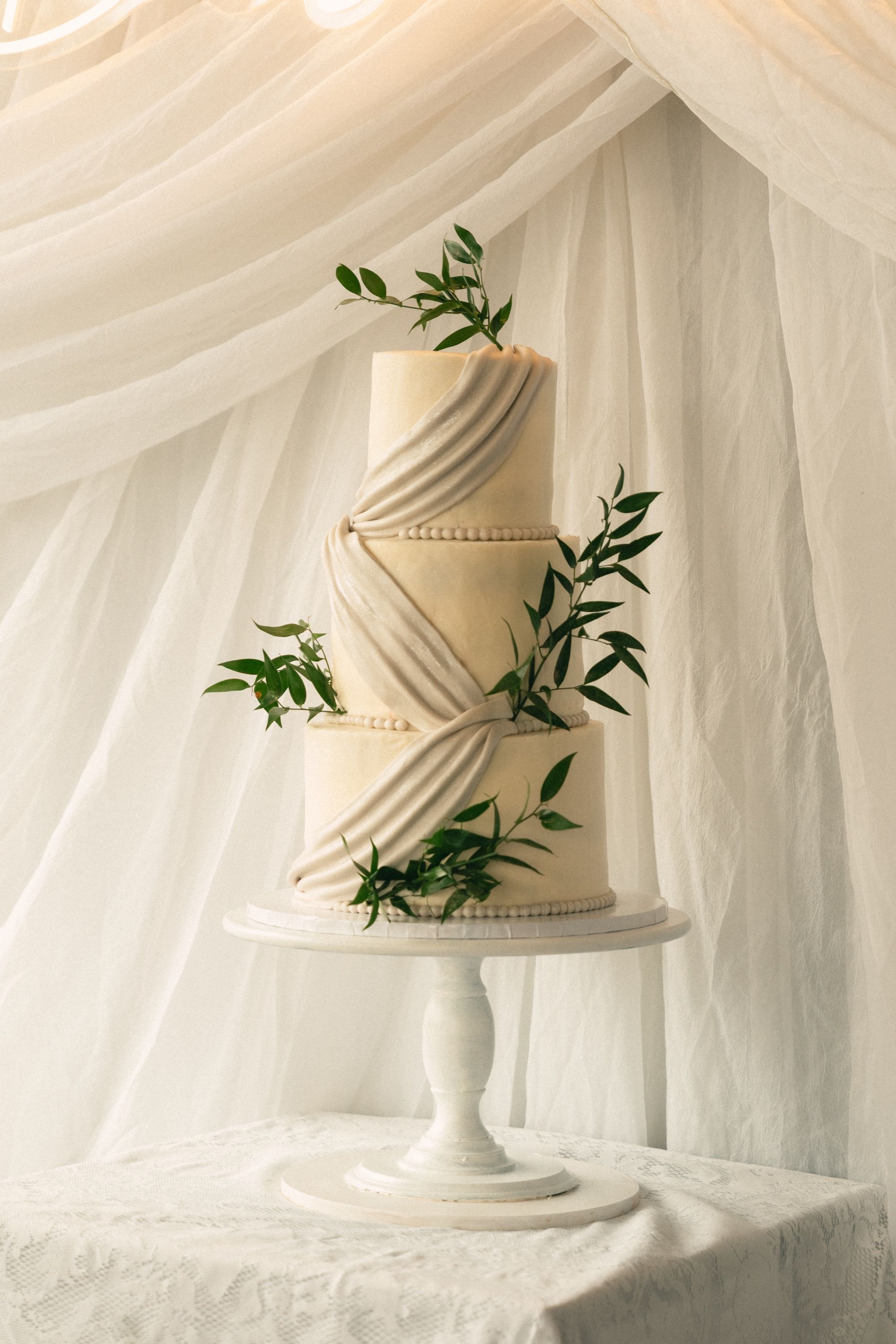 Wedding cake draped in tulle, Memphis wedding photography by Atkinson Studio