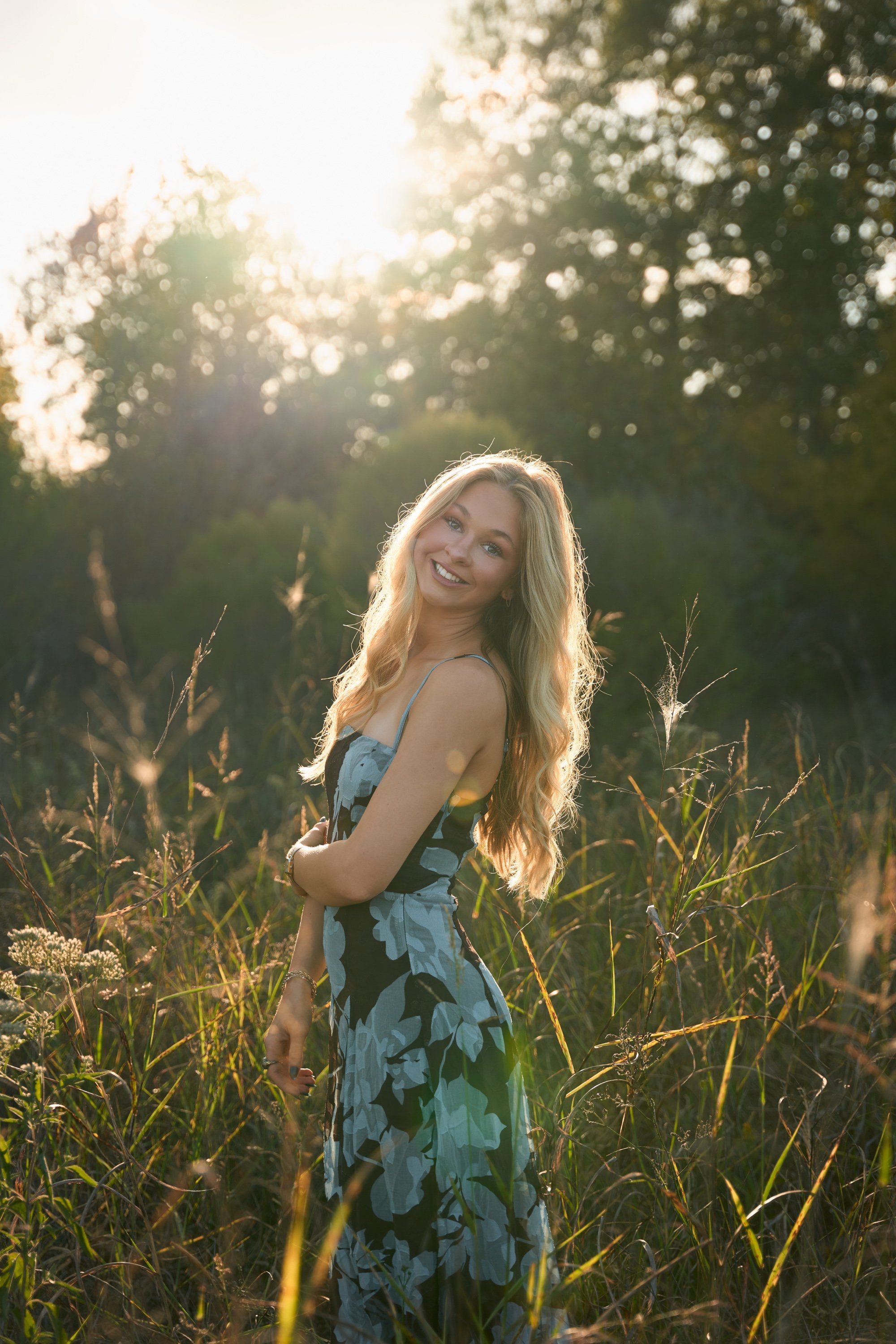 Backlit senior portrait in a meadow, Memphis senior photographer